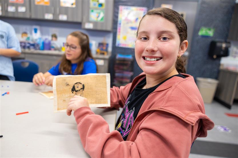 Students learning about embroidery